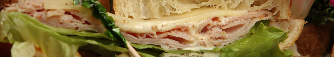 Eating Sandwich Cafe at Latte Vista Cafe & Coffee Shop restaurant in Lago Vista, TX.